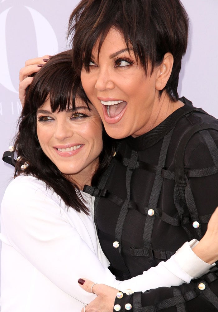 Selma Blair and Kris Jenner embrace on the red carpet