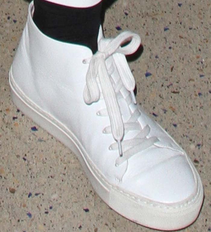 Kylie Jenner wears black socks in white Acne Studios sneakers