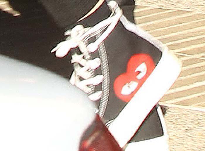 Kylie Jenner's high cut shoes from the Comme des Garcons Play x Converse collaboration