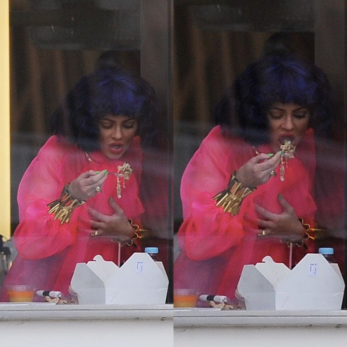 Kylie Jenner chowing down on some take-out to get re-energized in between photoshoots