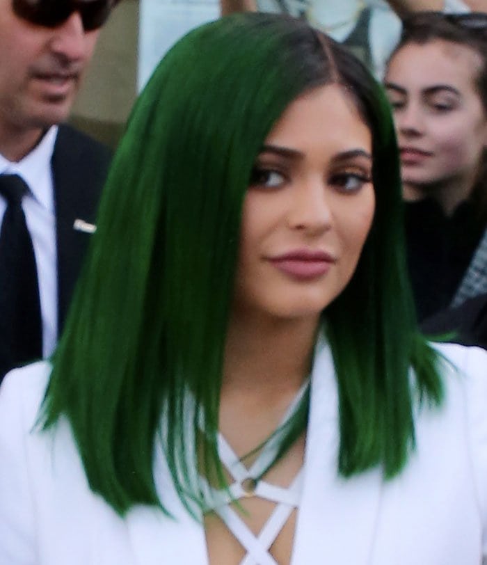 Kylie Jenner debuts her new green hair as she launches her latest line of lip glosses