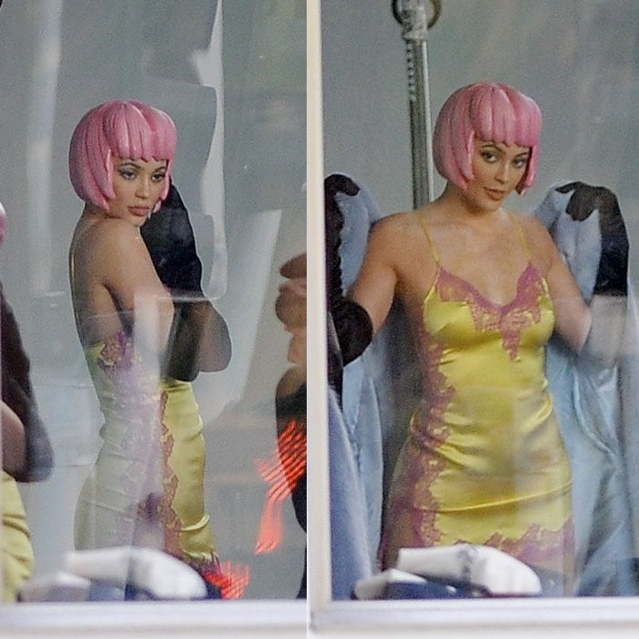 Kylie Jenner striking more poses in a pink wig and lingerie