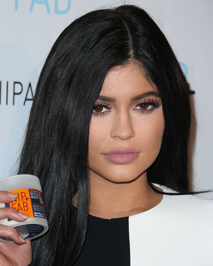 Kylie Jenner wears her hair down with plumped up lips at a Nip + Fab party