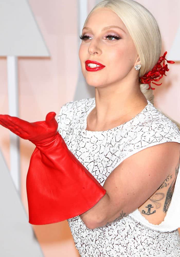 Lady Gaga's elbow-length red leather gloves at the 87th Annual Oscars