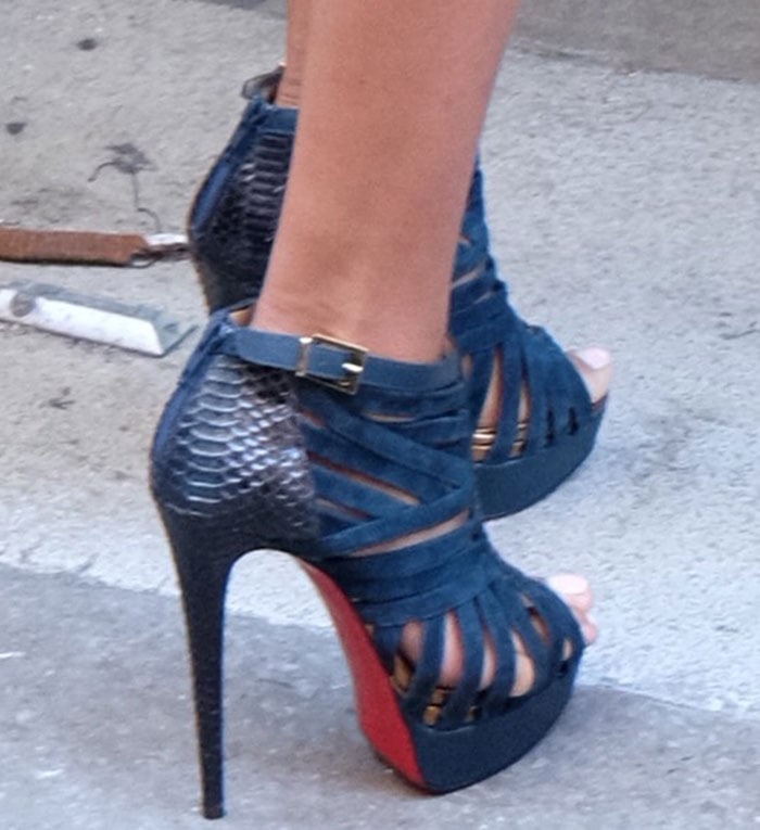 La La Anthony's feet in Christian Louboutin booties