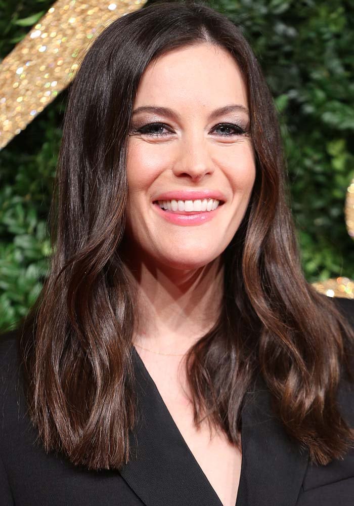 Liv Tyler shows off her shorter brown hair at the 2015 British Fashion Awards