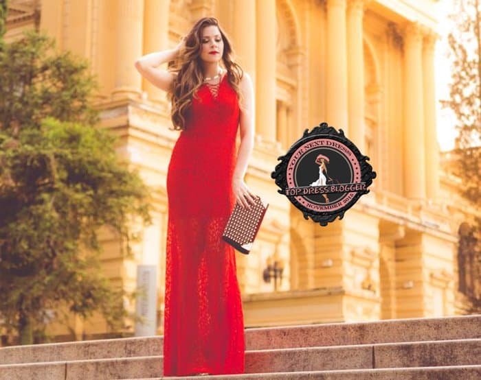 Luise highlights her slim figure in a long red lace dress
