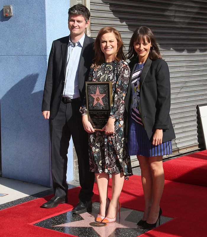 Amy Poehler poses on her Hollywood Walk of Fame star with Michael Schur and Rashida Jones