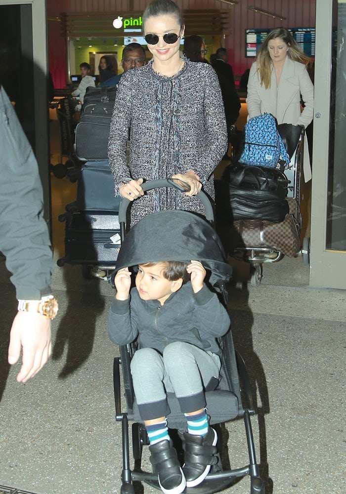 Miranda Kerr pushes her son, Flynn Christopher Bloom, in a stroller