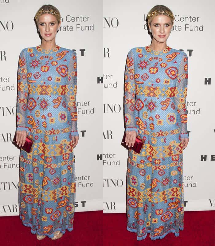 Nicky Hilton paired her stunning maxi dress with a gold leaf headpiece, statement earrings, and a pink and gold clutch