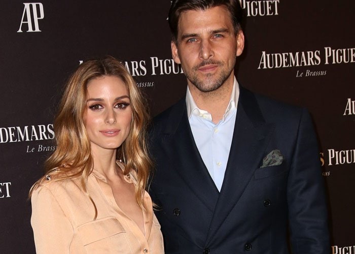 Olivia Palermo and husband Johannes Huebl pose for photos together