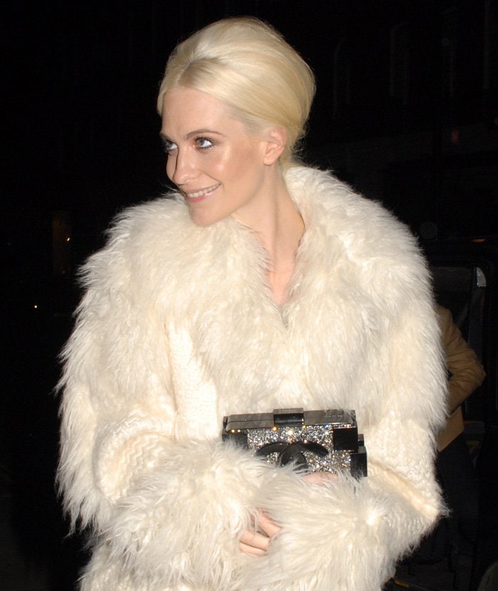 Poppy Delevingne in a white fur coat at the LOVE Magazine – Christmas party