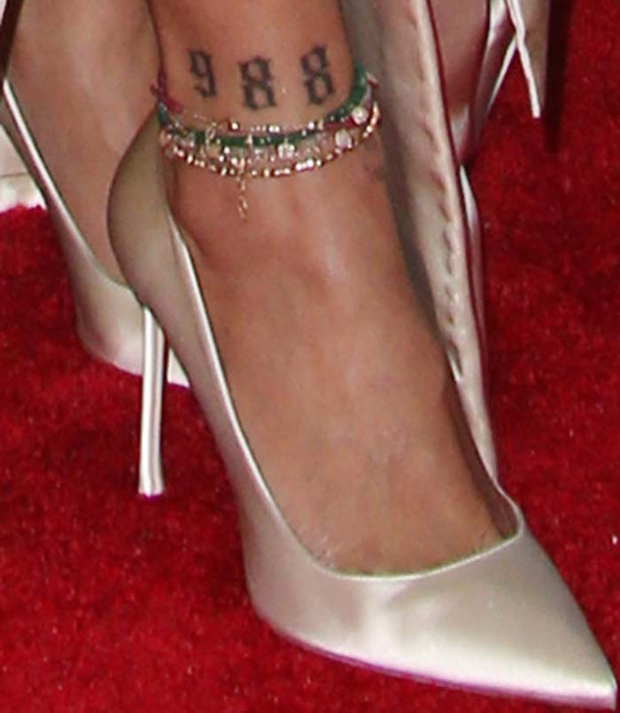 Rihanna's feet and tattoos in Christian Dior pumps