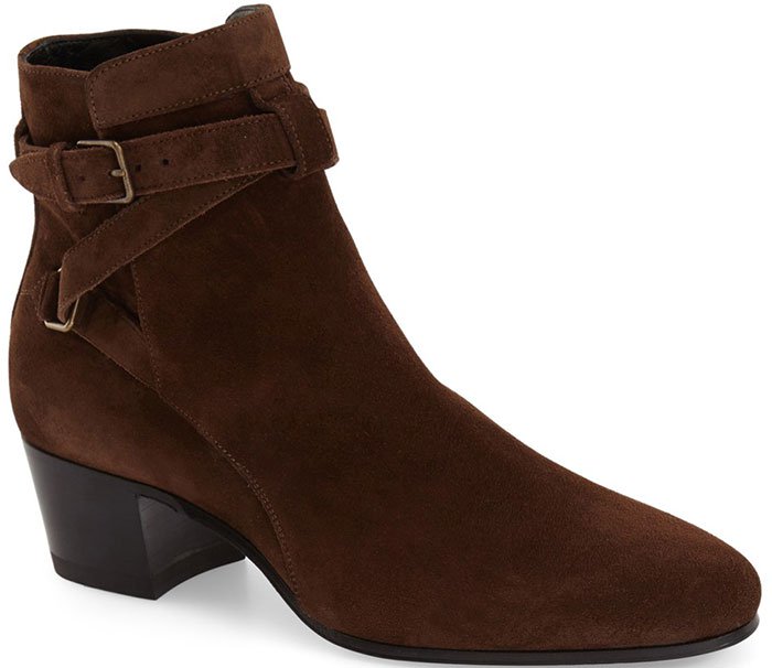 Equestrian straps gird a polished leather Jodhpur bootie with sleek panache