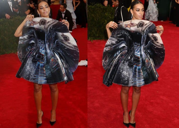 Solange Knowles in a printed Giles mini-dress with teensy pleats, looking almost unrecognizable without her usual regal cape or bold monochrome look