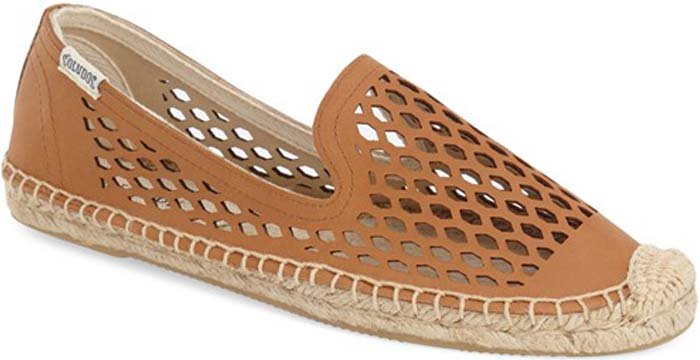 Lasered geo cutouts pepper an easygoing slip-on detailed with ropy espadrille trim