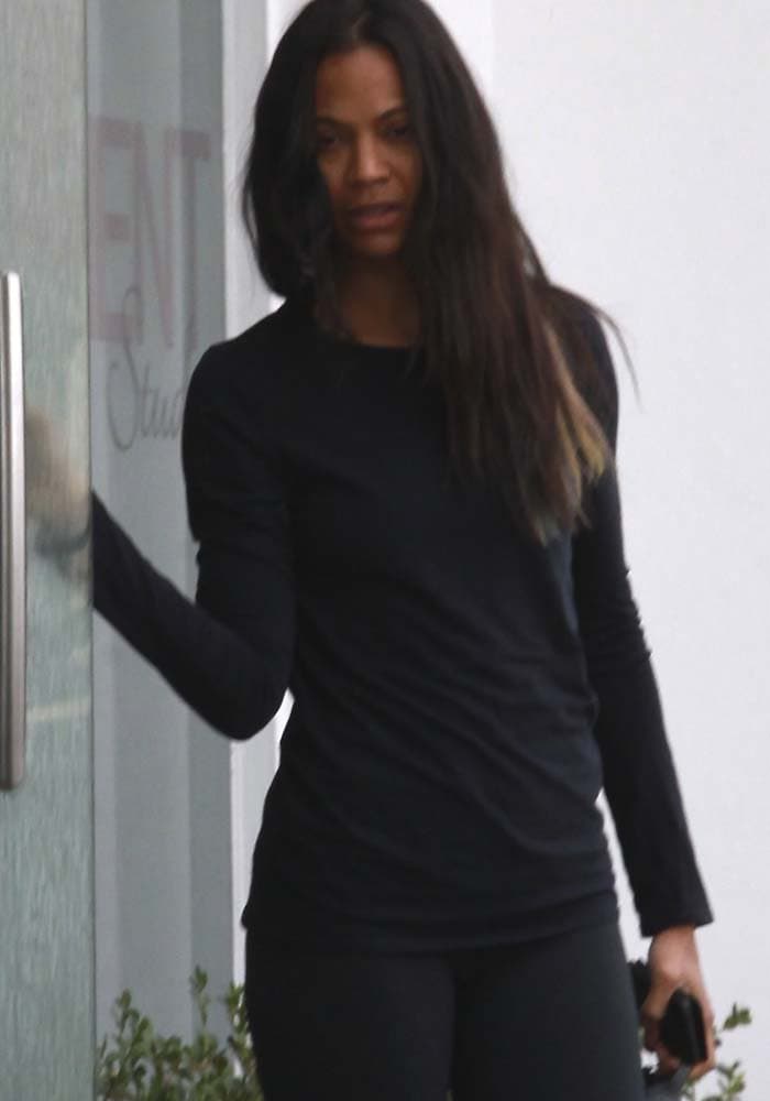 Zoe Saldaña wears her hair down as she leaves her house for an early morning workout