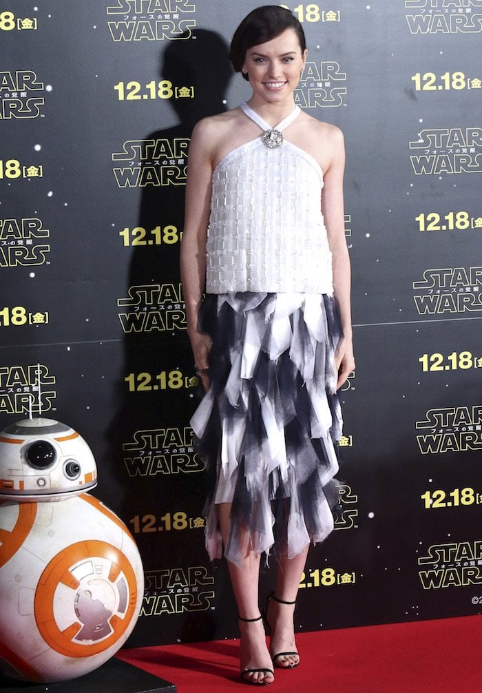 Daisy Ridley flaunts her sexy legs in Chanel for a "Star Wars: The Force Awakens" fan event
