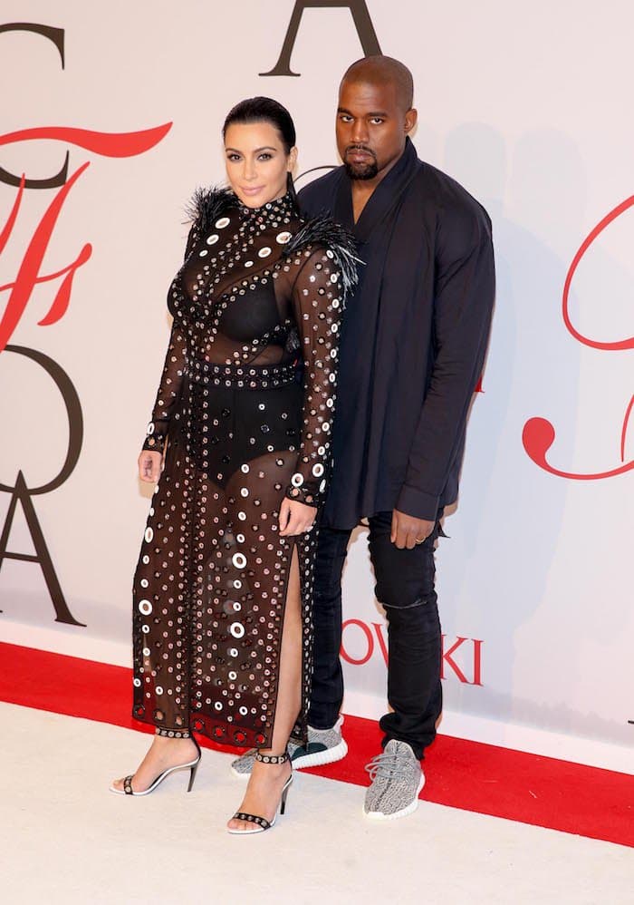 A pregnant Kim Kardashian attends the 2015 CFDA Fashion Awards in custom Proenza Shouler with husband Kanye West