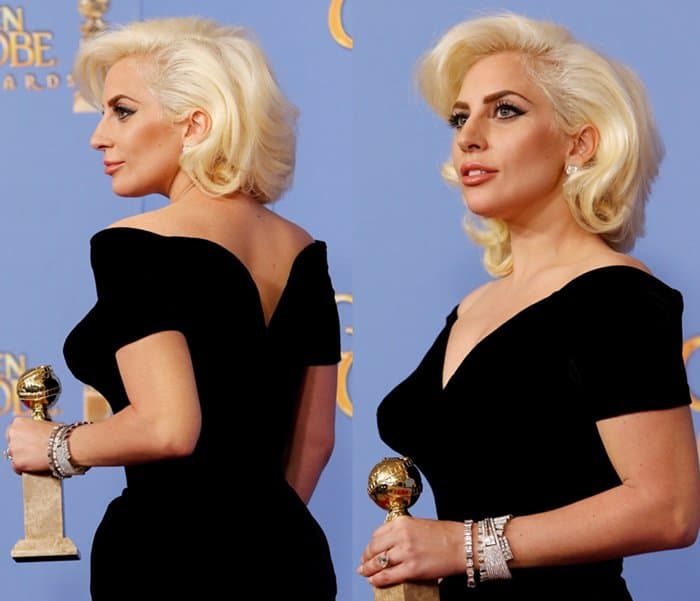 Lady Gaga exudes elegance in a close-up of her black velvet Atelier Versace gown, perfectly complementing her platinum blonde waves, as she proudly holds her Golden Globe Award at the 2016 ceremony