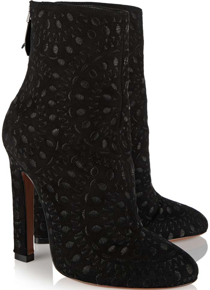 Alaïa's black suede boots have a cool, embroidered floral medallion motif