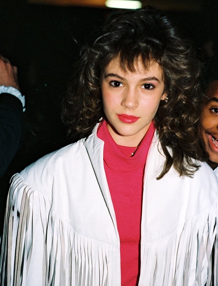 A youthful Alyssa Milano dazzles at the 14th Annual American Music Awards in 1987, showcasing her rising star status in the entertainment industry