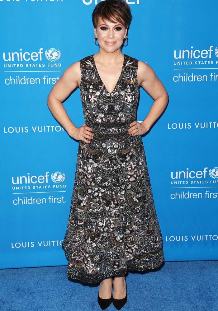 Alyssa Milano wears an embellished Alice + Olivia dress on the blue carpet of the UNICEF x Louis Vuitton ball