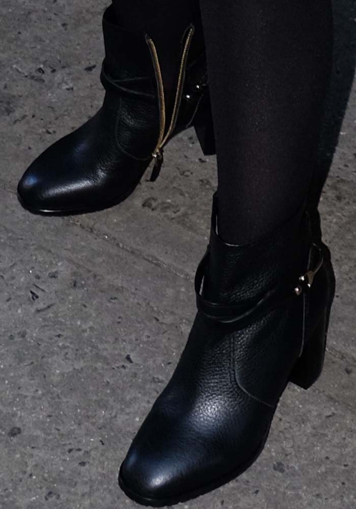 Alyssa Milano wears a pair of black zip-up ankle boots from L.K. Bennett