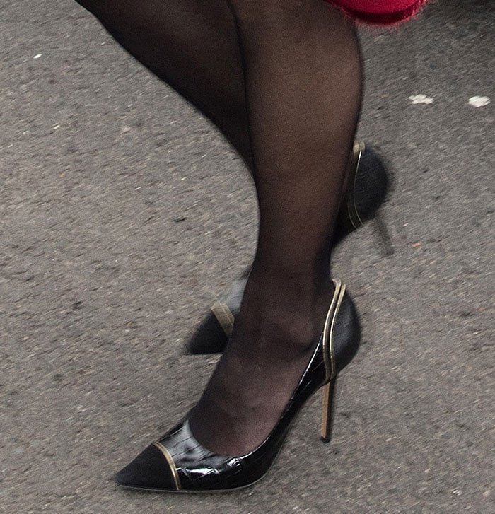 Amal Clooney's feet in black tights and gold-trimmed "Susi" pumps