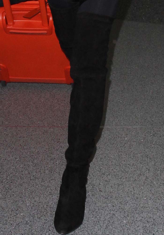 Bella Hadid in black suede Stuart Weitzman boots