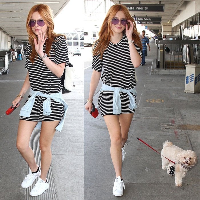 Bella Thorne and her pet dog departing from Los Angeles International Airport (LAX)