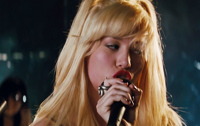 Brie Larson, at 19, captures the essence of Natalie V. 'Envy' Adams in 'Scott Pilgrim vs. the World', embodying the role of the charismatic lead singer of the fictional band, Black Sheep