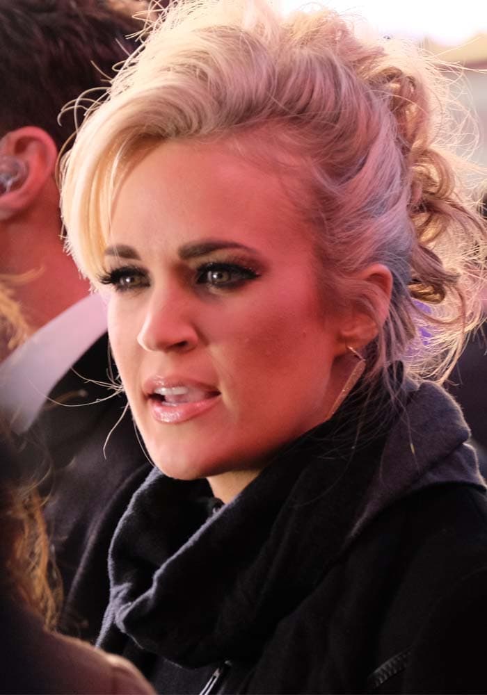 Carrie Underwood wears her hair up at the "Dick Clark's New Year's Rockin' Eve" celebration