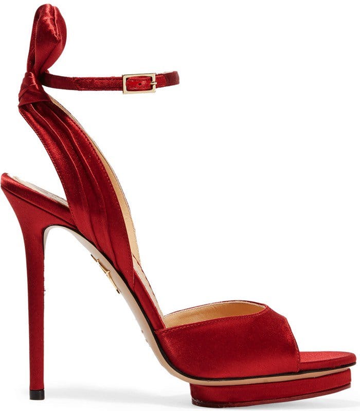 Crafted from sumptuous red satin, this pair is detailed with a knotted bow detail at the back and the 5-inch heel is balanced by the label's signature island platform, ensuring evening-long comfort