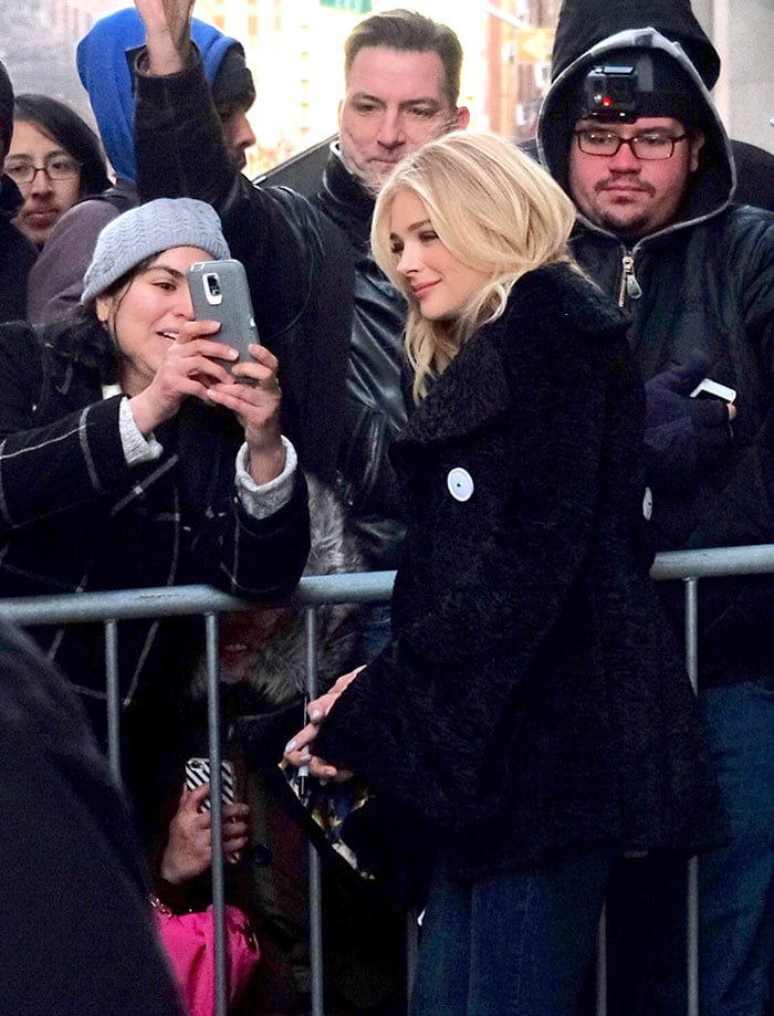 Chloë Grace Moretz takes a selfie with a fan while promoting her new movie in New York City