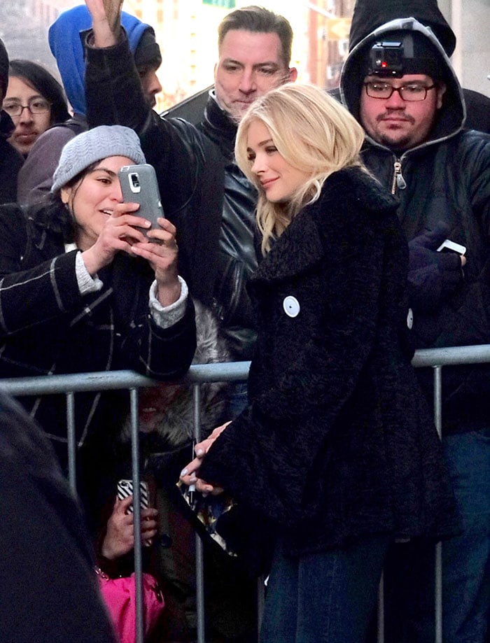 Chloe Grace Moretz takes a selfie with a fan while promoting her new movie in New York City