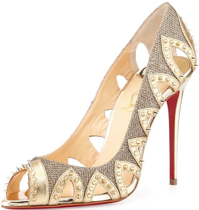 Christian Louboutin's Pinder City pump channels another era with its artful leather cutouts and textured goldtone finish