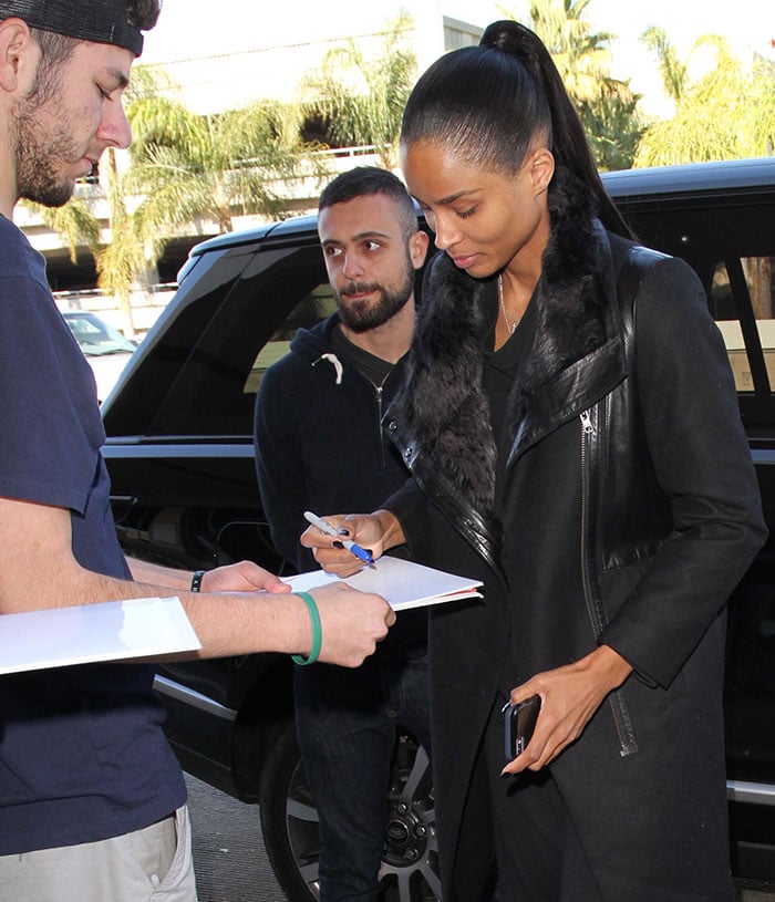 Ciara signing autographs for fans at LAX