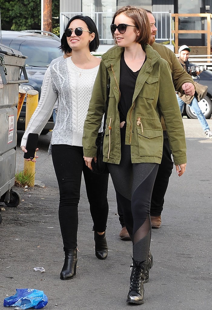 Lily Collins and Demi Lovato both wear their hair down as they leave lunch at La Conversation