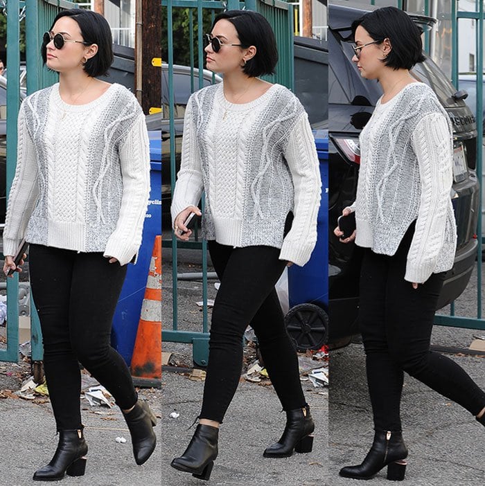 Demi Lovato wears a Derek Lam knit sweater and Frame Denim jeans on a lunch date