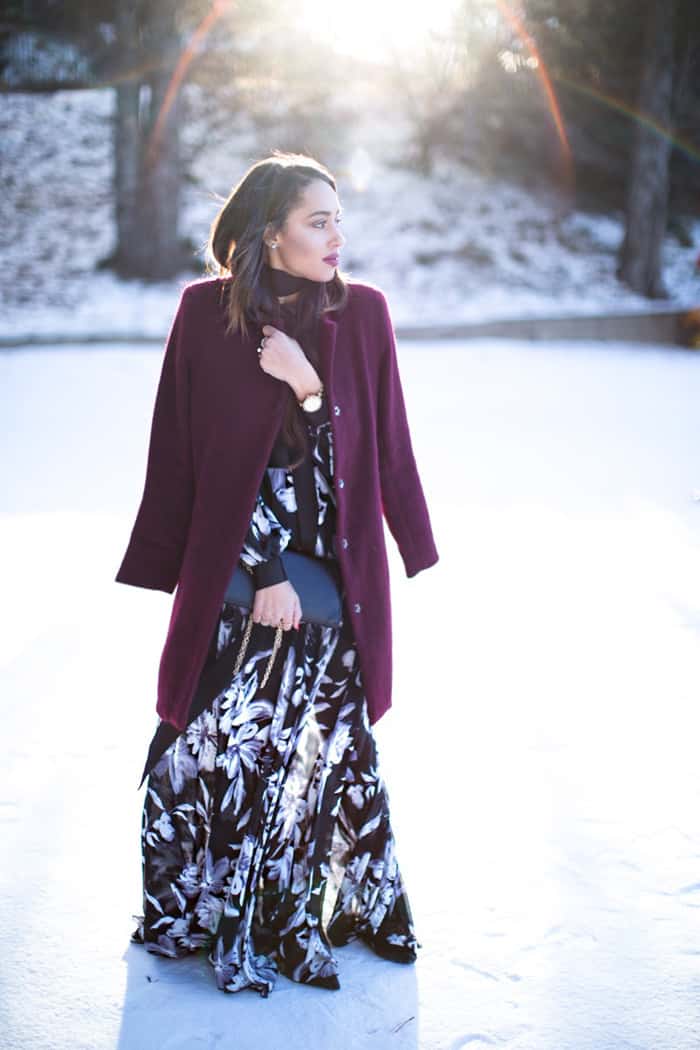 Elizabeth layers a burgundy coat over her summery maxi dress