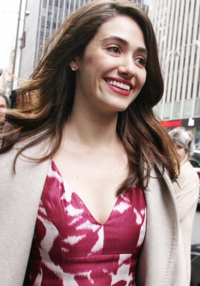 Emmy Rossum wears her hair down as she visits SiriusXM's offices