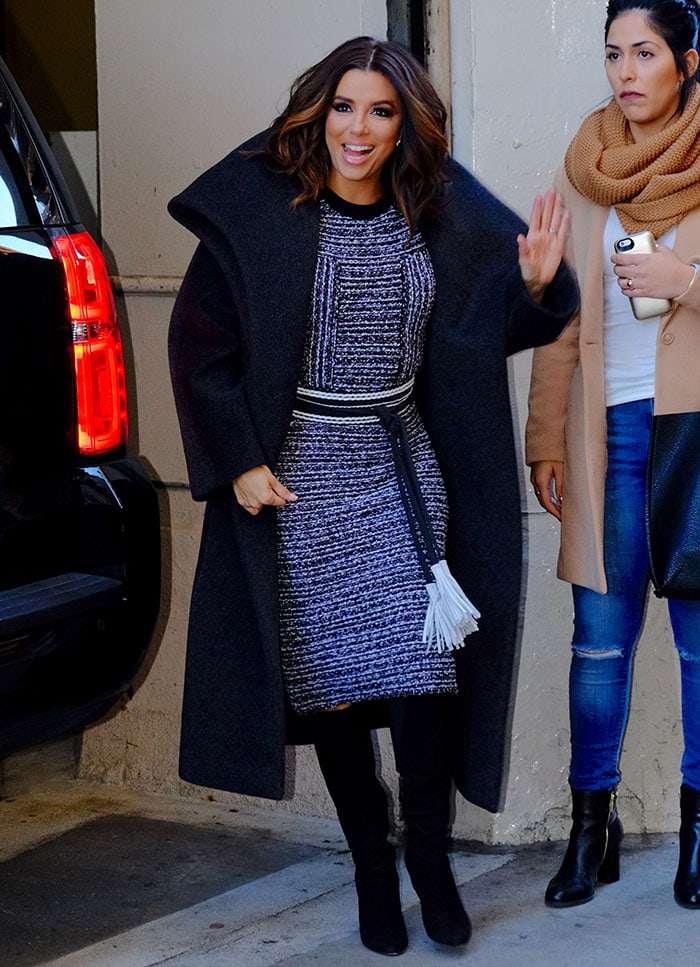 Eva Longoria wears her hair in curls as she arrives at Huffington Post