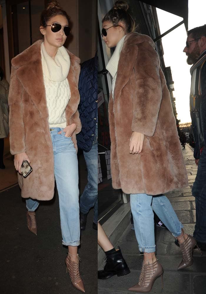 Gigi Hadid showcases her effortlessly chic street style in Paris, pairing a cozy oversized sweater and fur coat with casual jeans and nude Le Silla cage heels