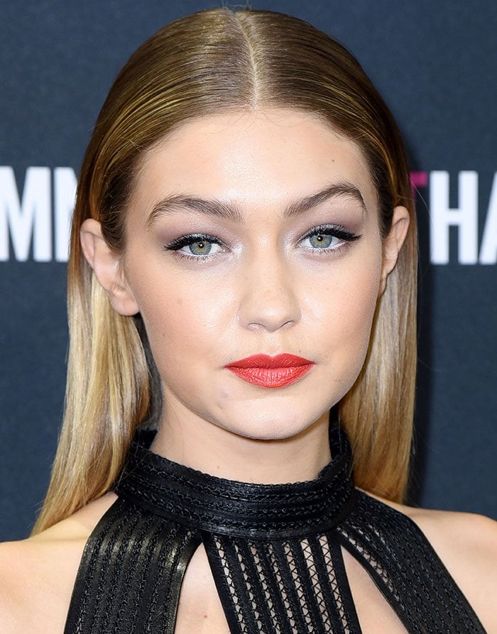 Gigi Hadid wears her hair center-parted and down at the Maybelline New York Makeup Runway