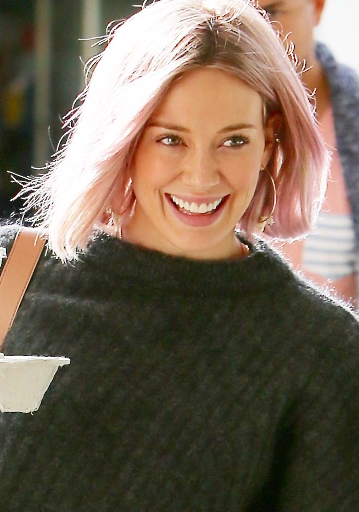 Hilary Duff shows off her new pink hair as she picks shops at Tom's Toys