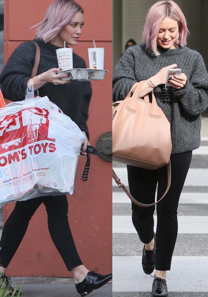 Hilary Duff wears an oversized sweater and carries a Givenchy bag while out shopping in Los Angeles
