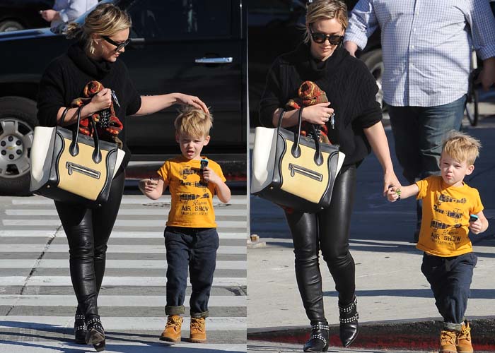 Hilary Duff holds a Céline bag in one hand and her son Luca in the other