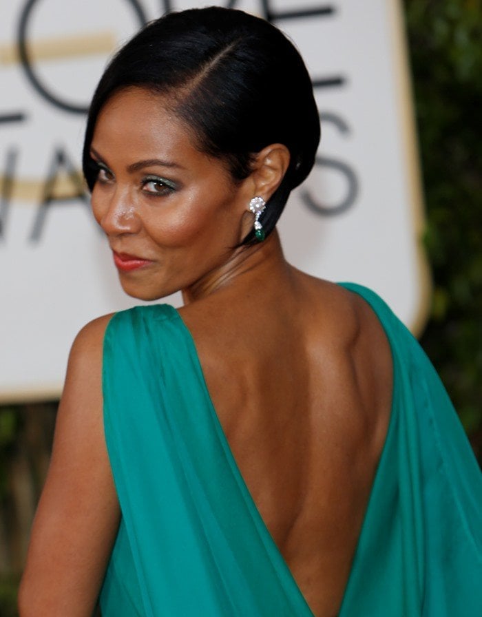 Jada Pinkett Smith shows off her toned back in an emerald green chiffon gown from Atelier Versace