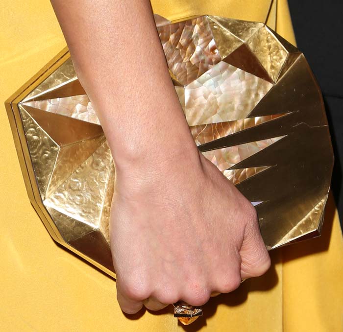 Jamie Chung carries an interesting geometric clutch from Emm Kuo